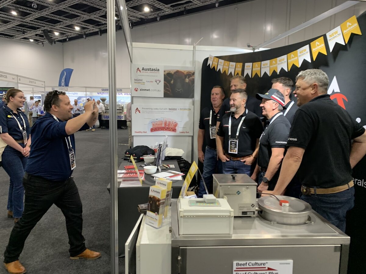 Sean from CoBright is taking a group photo of the Austasia team at their BeefEx 2024 stall